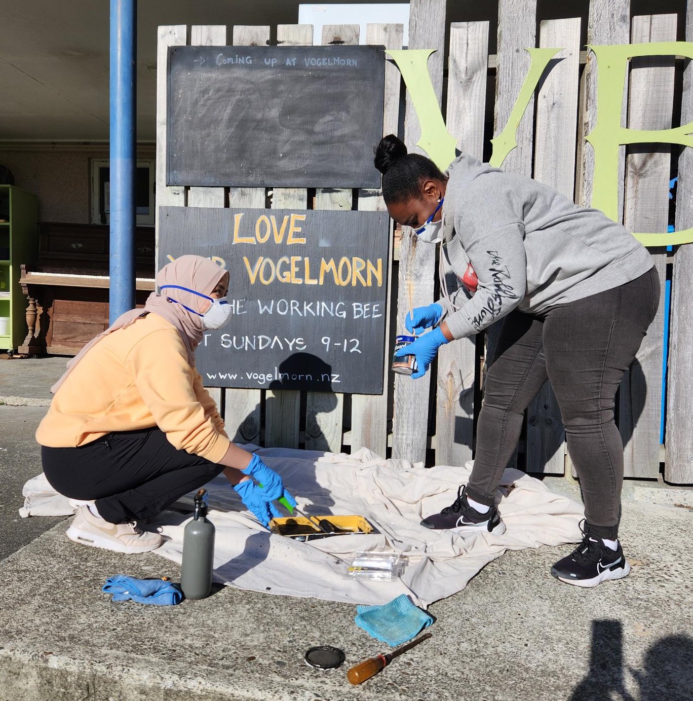 Volunteers clean signs at Vogelmorn 